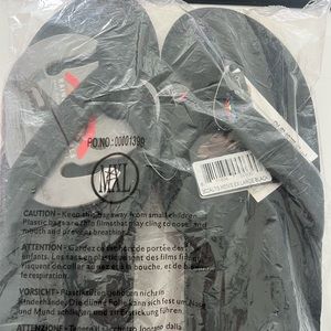 Brand new still in package Rainbow black sandals!